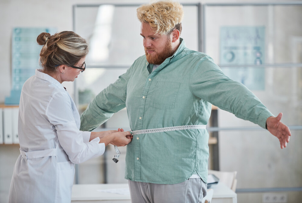 Physician-guided medically assisted weight loss consultation with a patient