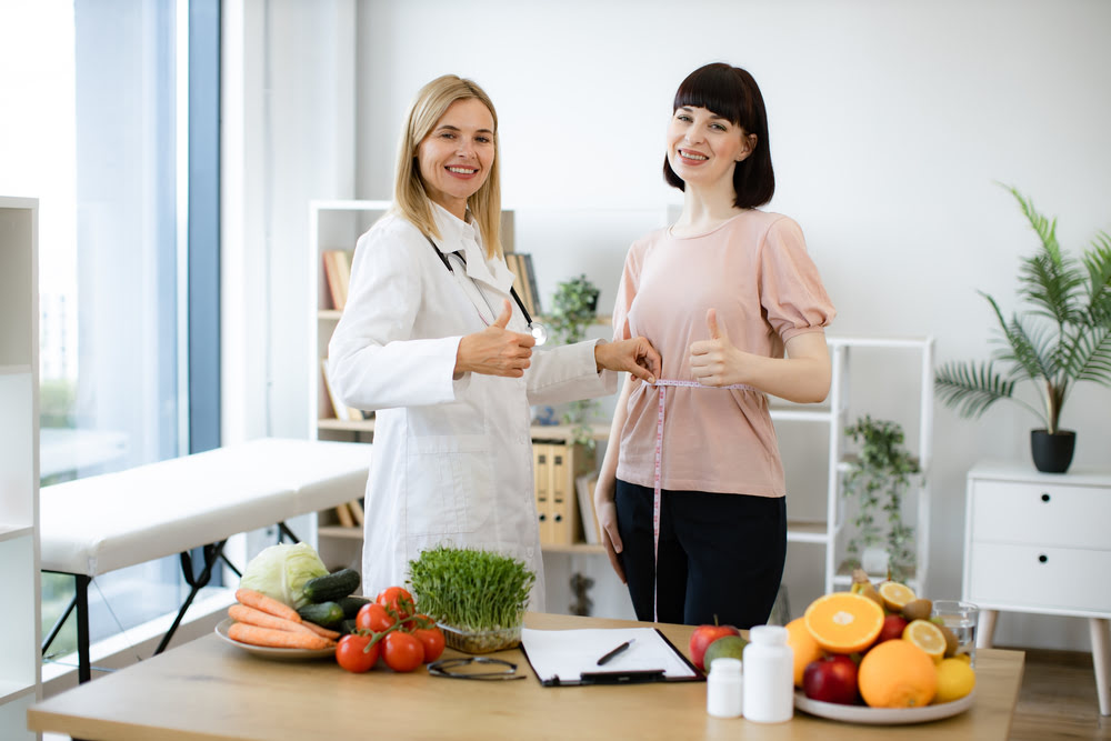 Physician-guided medically assisted weight loss consultation with a patient