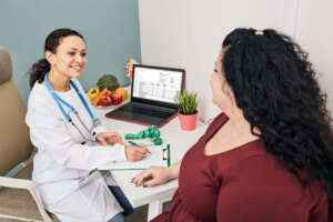 Physician-guided medically assisted weight loss consultation with a patient