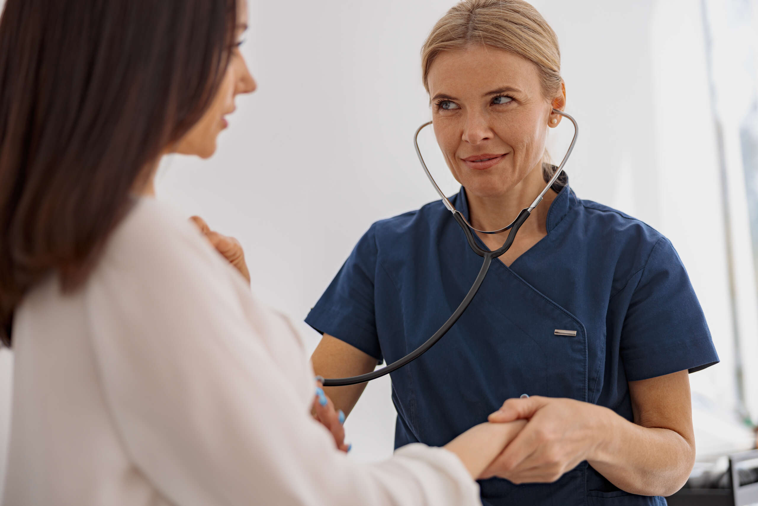 Doctor performing routine checkup with patient
