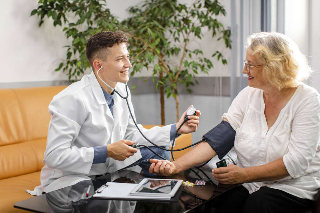 Doctor checking a woman’s blood pressure elevated due to obesity.